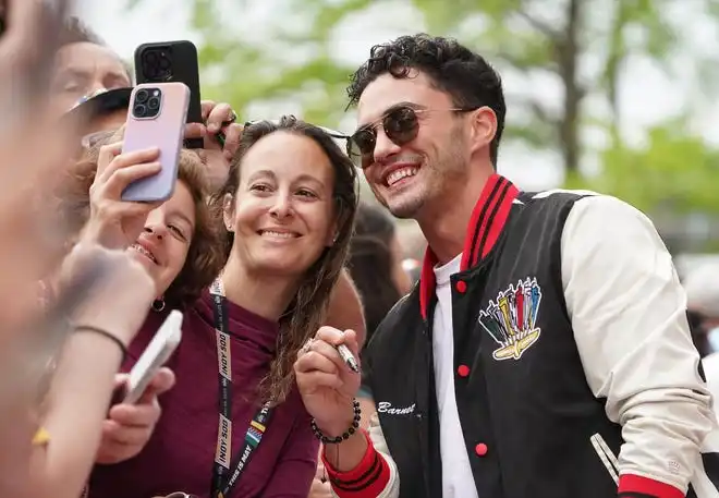 Actor Darren Barnet walks the celebrity red carpet on Sunday, May 26, 2024, during the 108th running of the Indianapolis 500 at Indianapolis Motor Speedway.