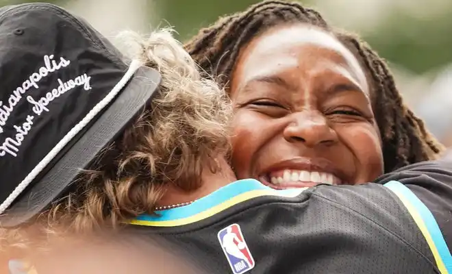 Retired WNBA player Tamika Catchings hugs actor Drew Powell on the celebrity red carpet on Sunday, May 26, 2024, during the 108th running of the Indianapolis 500 at Indianapolis Motor Speedway.