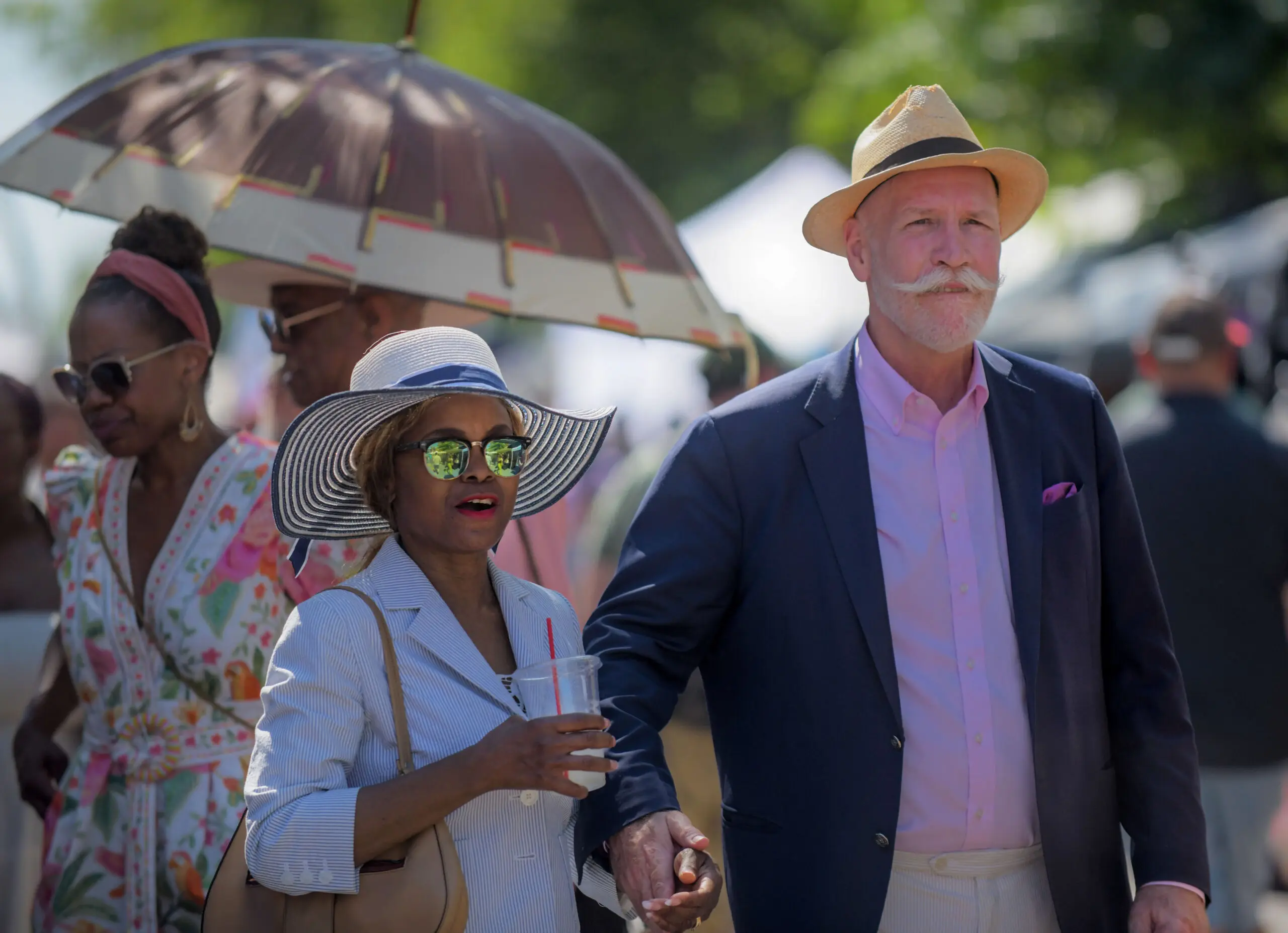 Georgia Howard and Daniel Howard of Eutaw Place walk together during the annual Sowebo arts and music festival around Hollins Market. (Karl Merton Ferron/Staff)