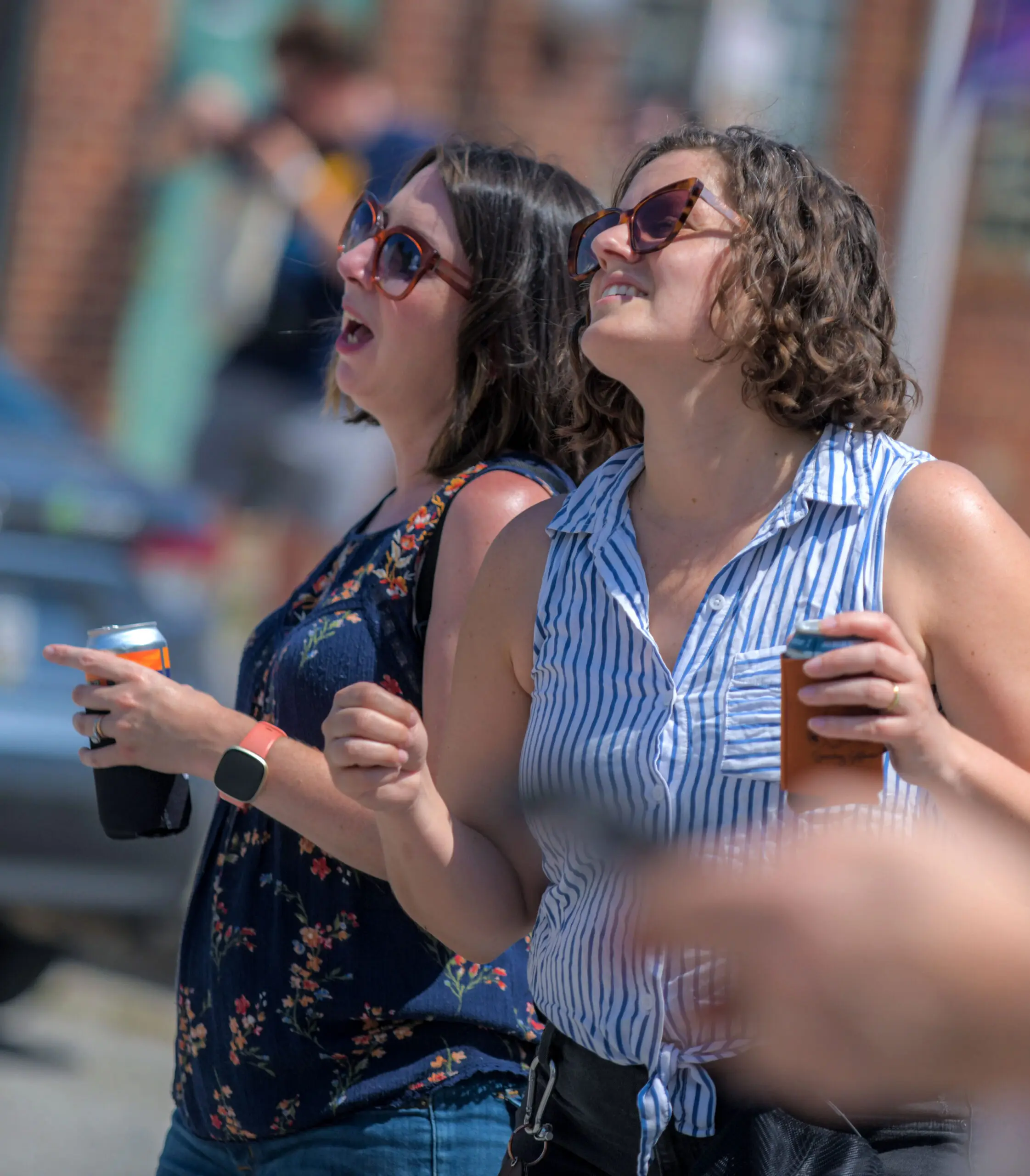 Beth Harper of Catonsville, left and Bonnie Lander of Hollins Market, who were band members former band members dance to the music performed by Barnyard Sharks during the annual Sowebo arts and music festival around Hollins Market. (Karl Merton Ferron/Staff)