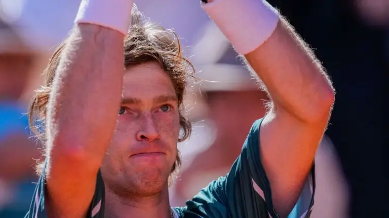 Andrey Rublev, of Russia, applauds after winning a match against Taylor Fritz, of United States, during the Mutua Madrid Open tennis tournament in Madrid, Spain, Friday, May 3, 2024. (AP Photo/Bernat Armangue)