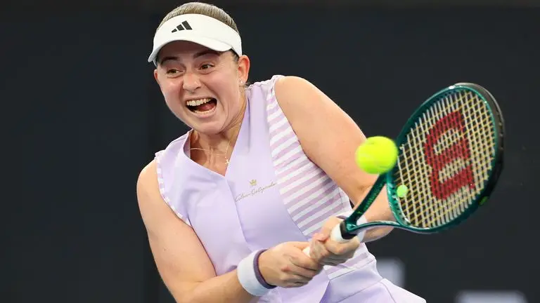 Jelena Ostapenko of Latvia plays a shot in her quarter-final match against Victoria Azarenka of Belarus during the Brisbane International tennis tournament in Brisbane, Australia, Friday, Jan. 5, 2024. (AP Photo/Tertius Pickard)