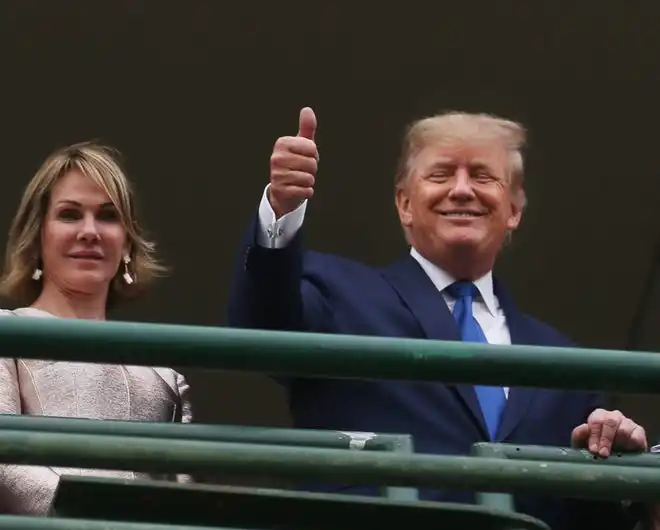 In 2022, former President Donald Trump reacts to the crowd before the beginning of the 148 Kentucky Derby.