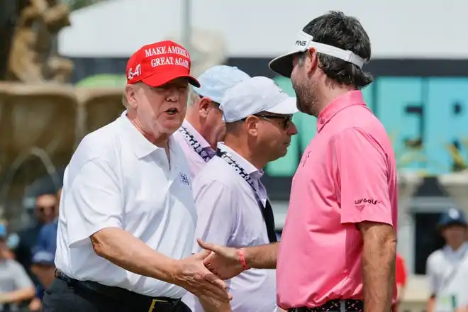 Donald Trump, left, meets with Bubba Watson of the RangeGoats on the practice green before the final round of LIV Golf Miami golf tournament at Trump National Doral in 2024.