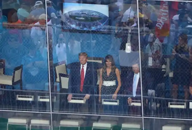 In 2020, President Donald Trump watches alongside wife Melania Trump from the 500 Club suites prior to the Daytona 500 at Daytona International Speedway.