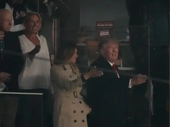 In 2021, former President Donald Trump and First Lady Melania Trump do the Tomahawk Chop prior to game four of the 2021 World Series between the Atlanta Braves and the Houston Astros at Truist Park.