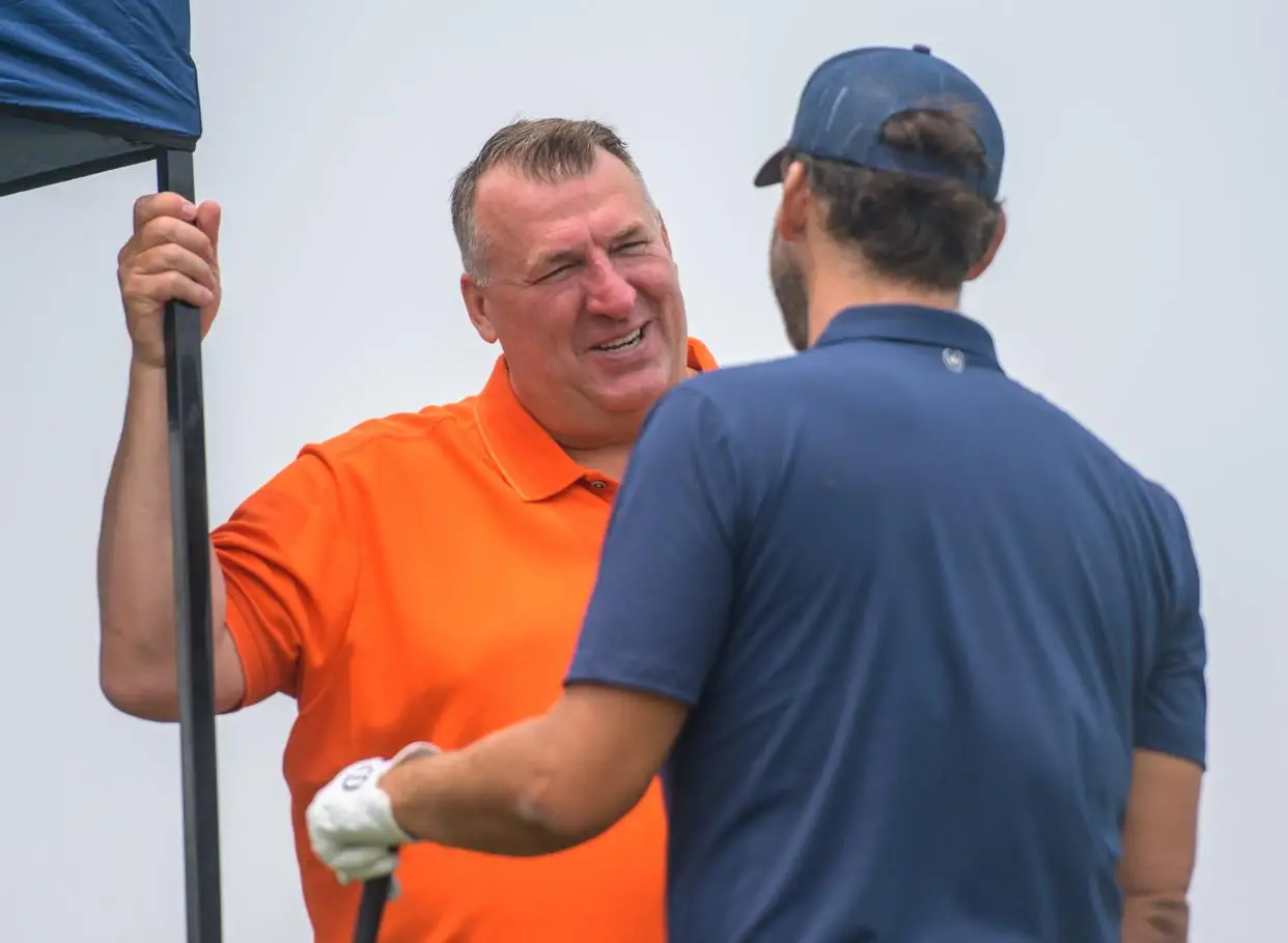 University of Illinois head football coach Bret Bielema chats with former NFL quarterback Tony Romo during during the OSF Children's Hospital of Illinois Championship & Pro-Am on Tuesday, June 27, 2023 at Metamora Fields Golf Club.