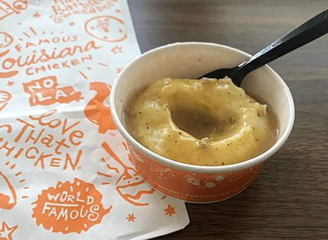 a cup of popeyes mashed potatoes