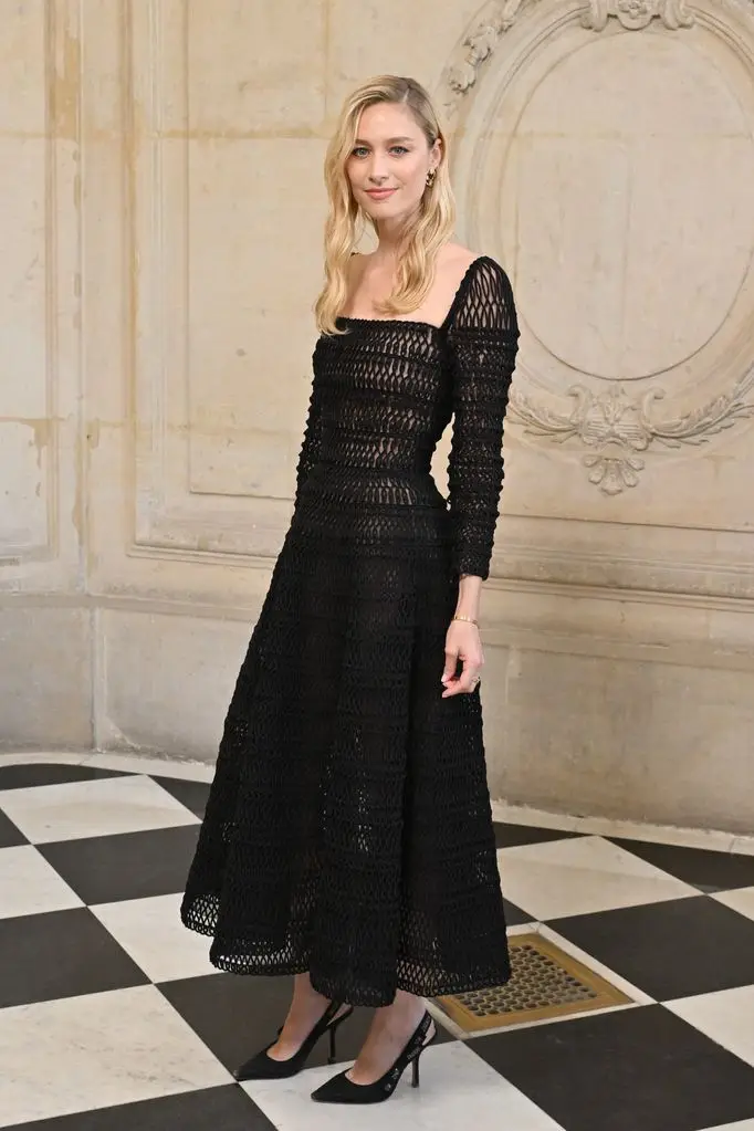 Beatrice Borromeo wearing a black semi-sheer wide circle midaxi gown