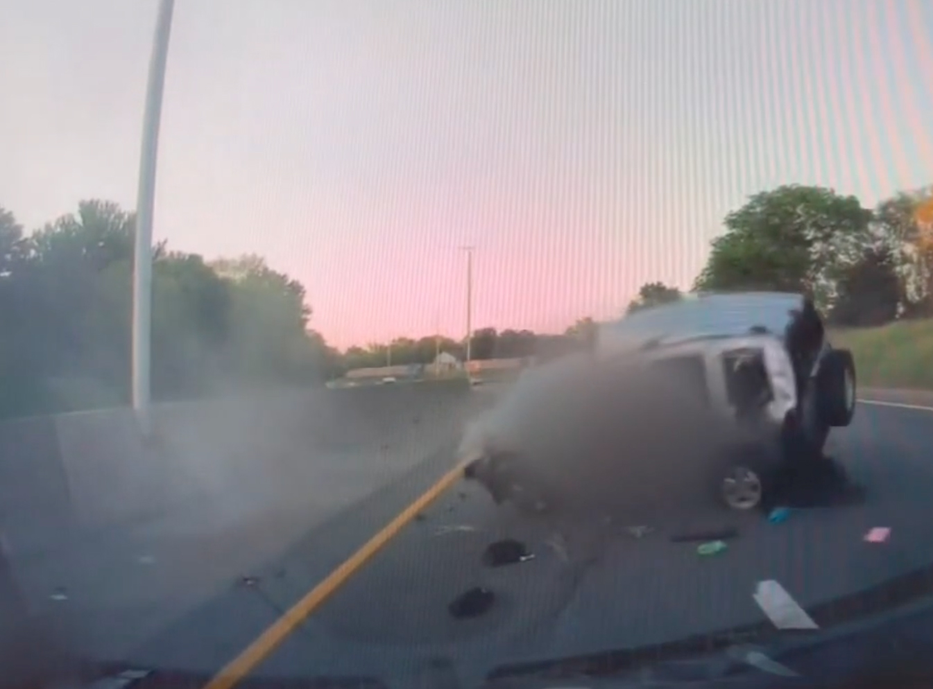 Insane dashcam footage shows car tumble across road like a domino and catch fire