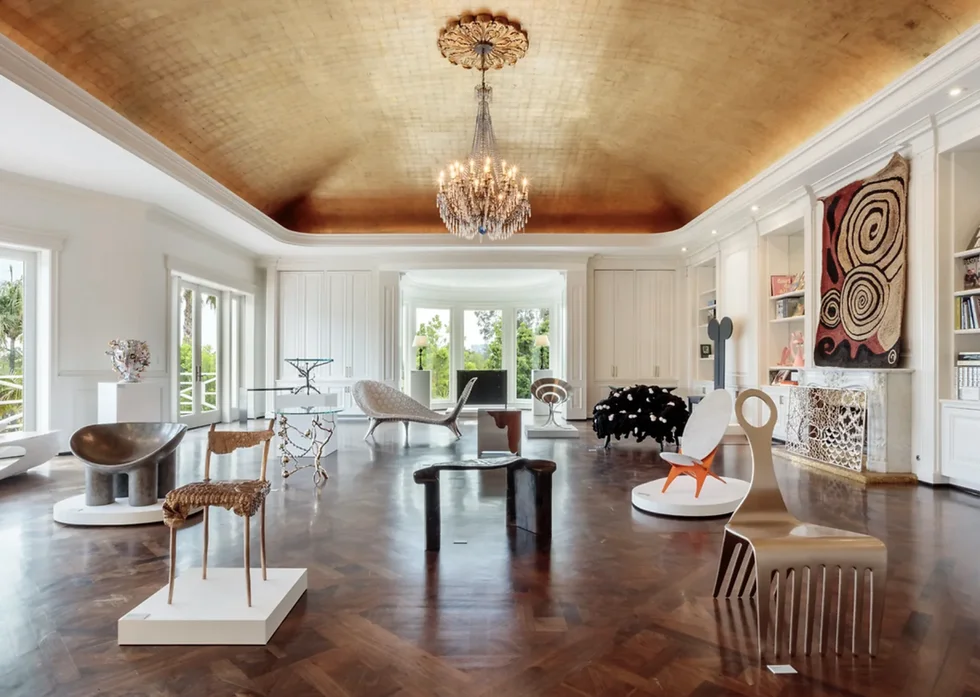 a large room with a chandelier and chairs