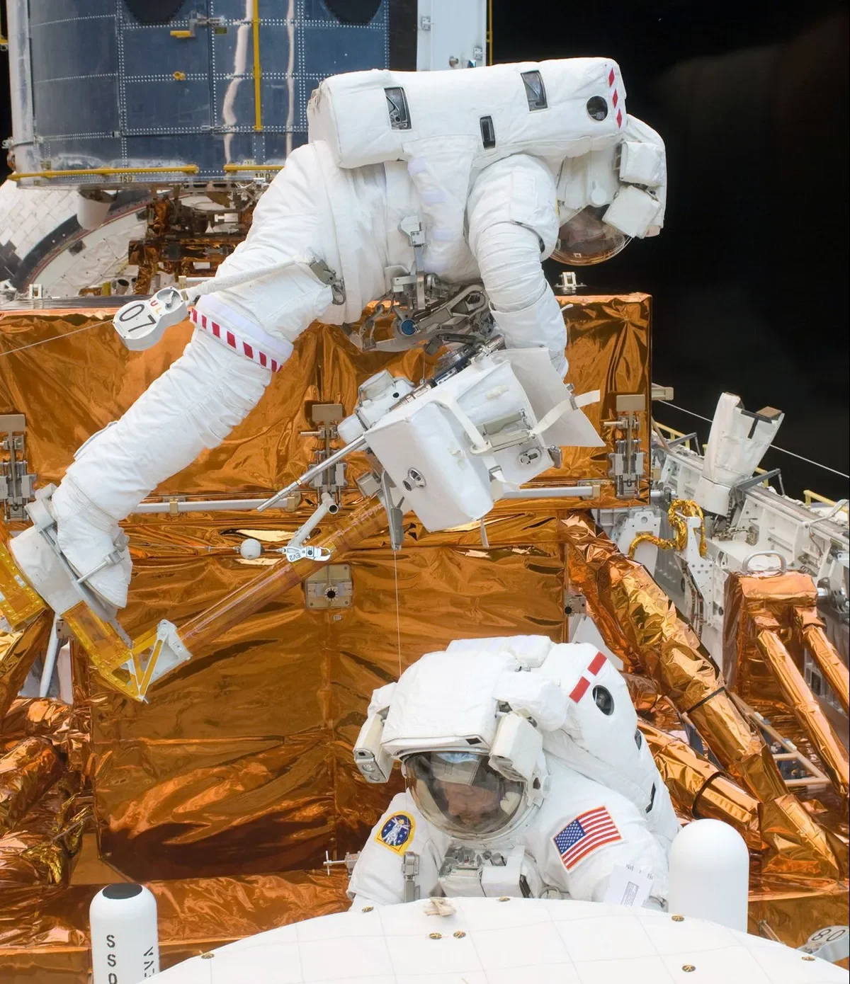 Astronauts Michael Good and Michael Massimino pictured during the final Hubble servicing mission. Credit: NASA