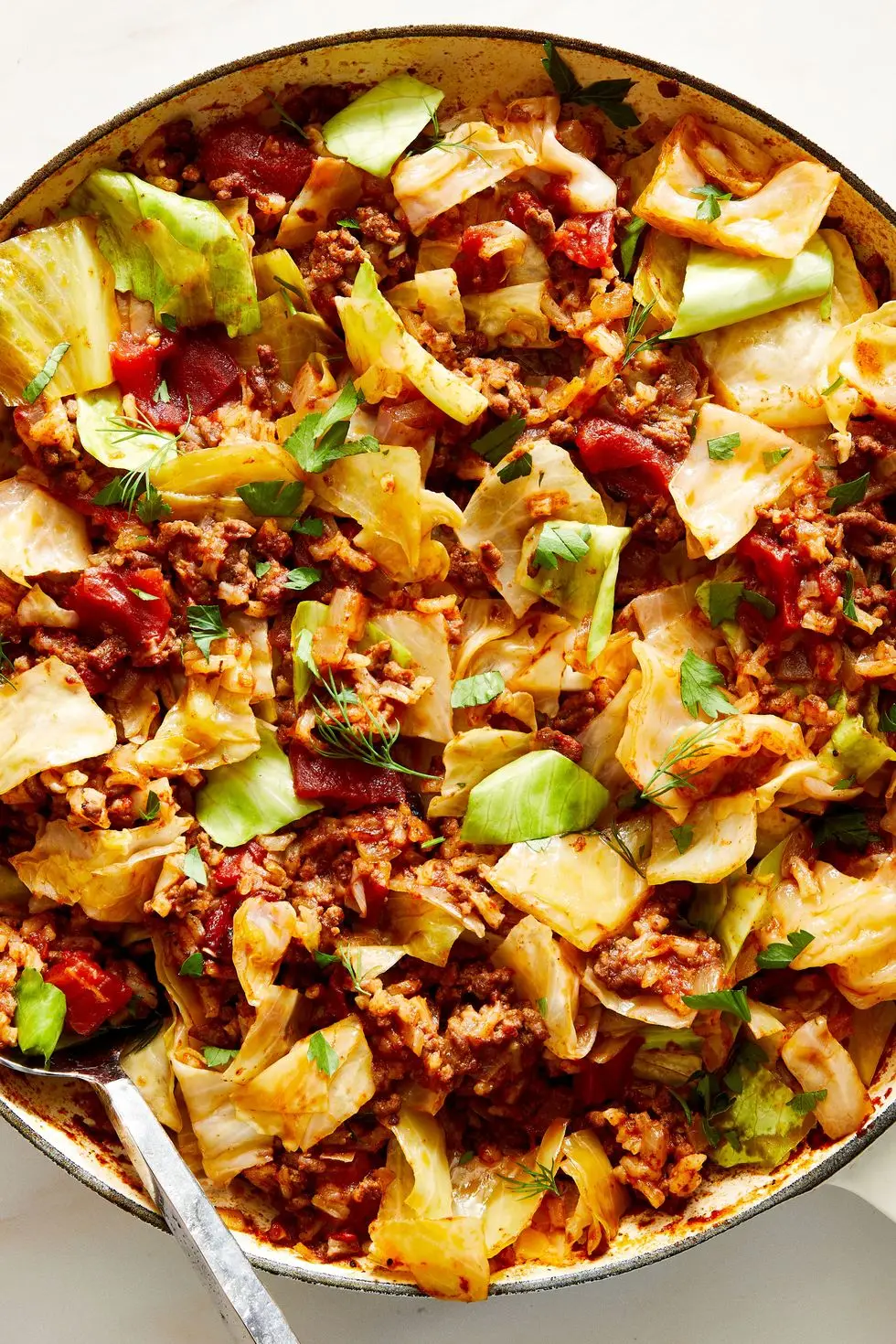 cabbage roll skillet sprinkled with fresh dill and parsley