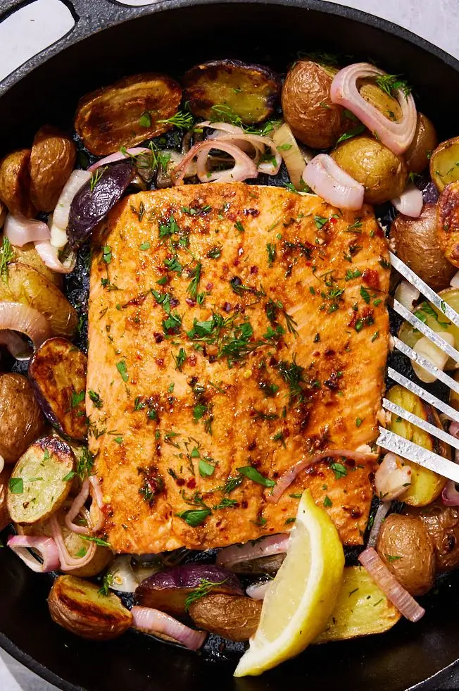 baked salmon potato skillet with shallots and dill yogurt sauce