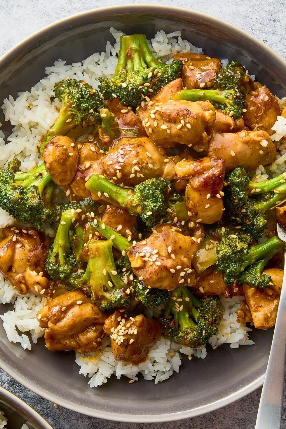 stir fried pieces of chicken and broccoli