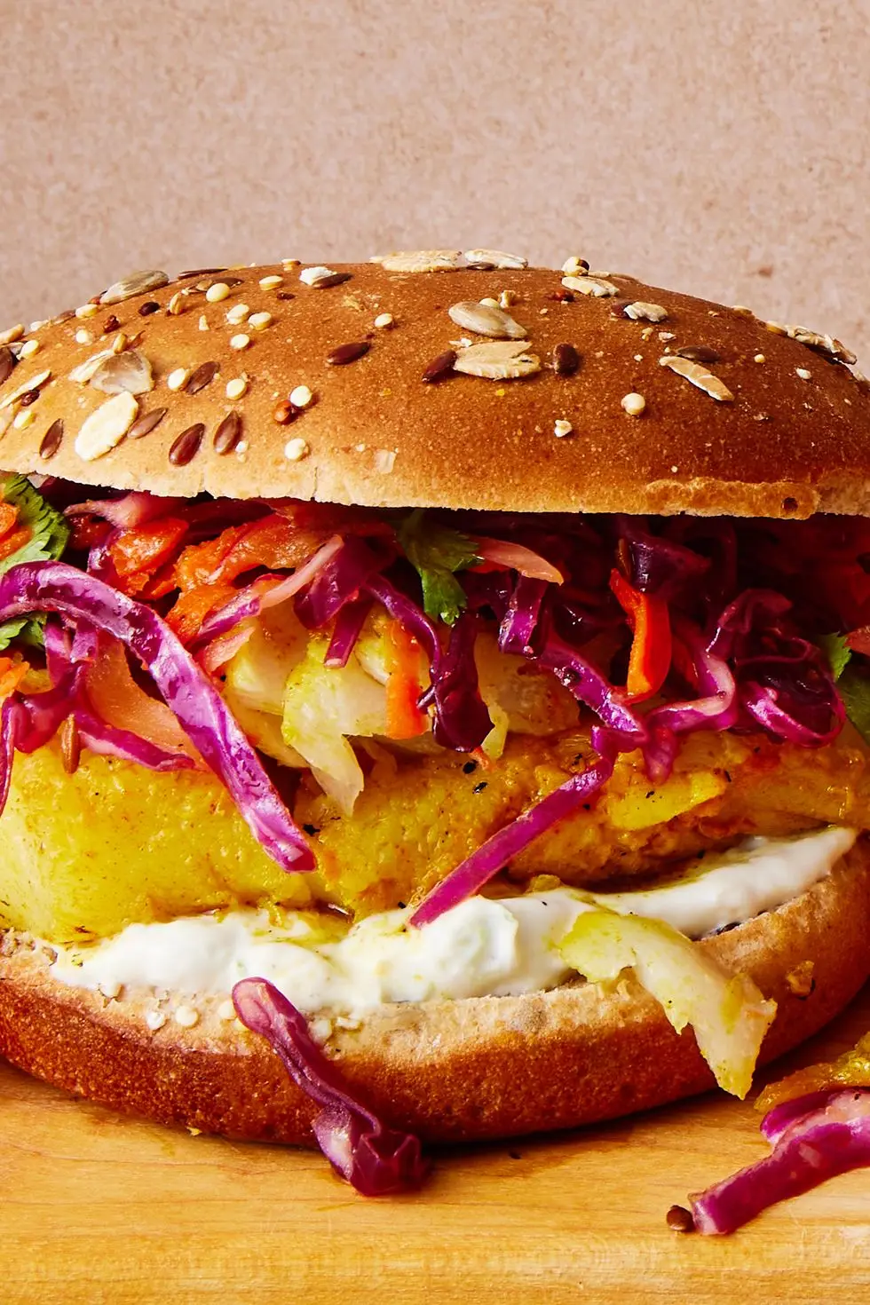 grilled fish sandwich with slaw and tzatziki on a multigrain bun