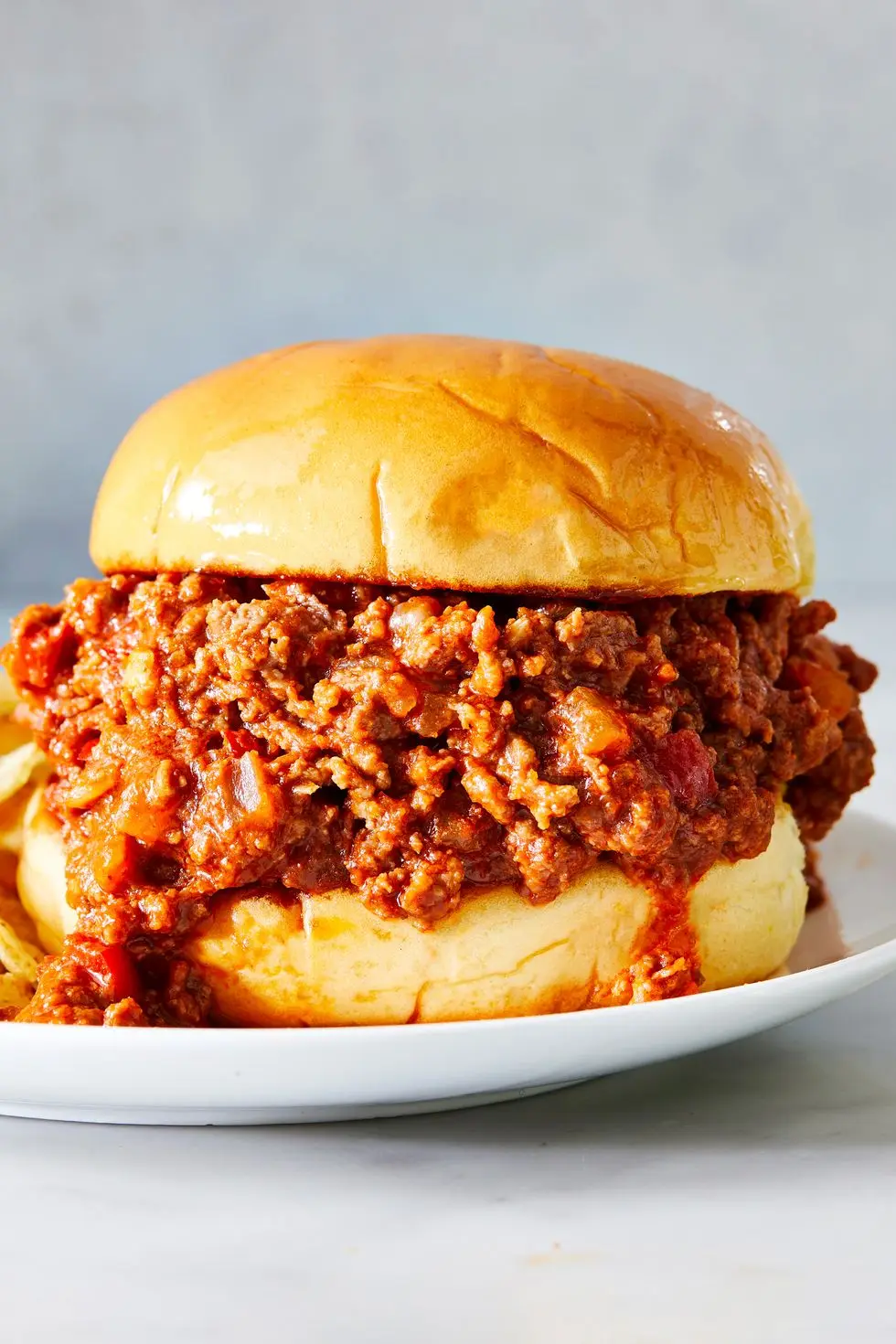 sloppy joes served on a toasted bun with chips