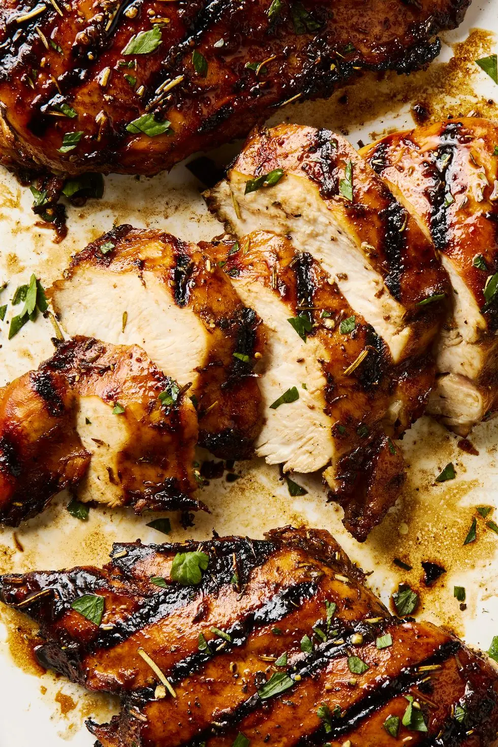 grilled chicken breasts topped with herbs