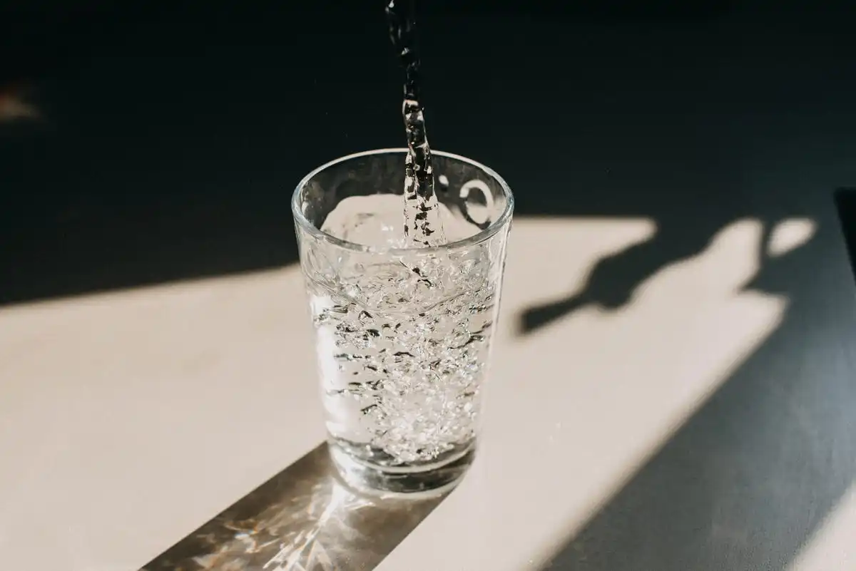 glass with water pouring in