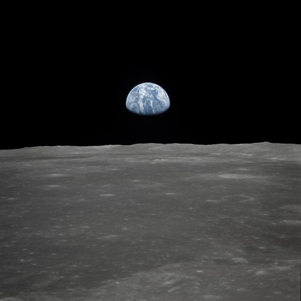 Why do photos of Earth from the Moon show an inky, black sky with no stars?