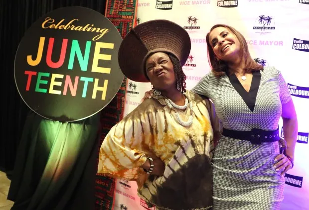 Priscilla Dames Blake and Dr. Elizabeth Garcia take pictures during a previous Juneteenth Celebration in Miramar. (Carline Jean / South Florida Sun Sentinel)