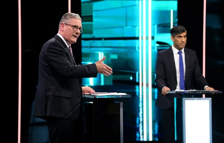 Labour Party leader Keir Starmer (L) and Prime Minister Rishi Sunak pictured on stage during the first head-to-head TV debate of the General Election.