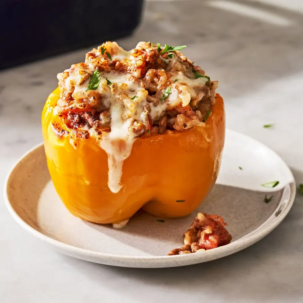 colorful stuffed peppers with ground beef and tomato rice