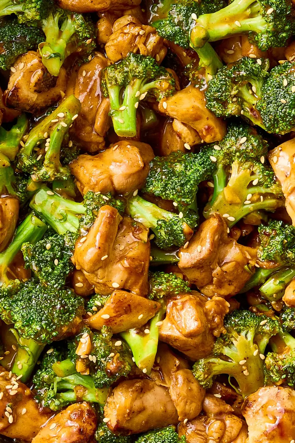 stir fried pieces of chicken and broccoli