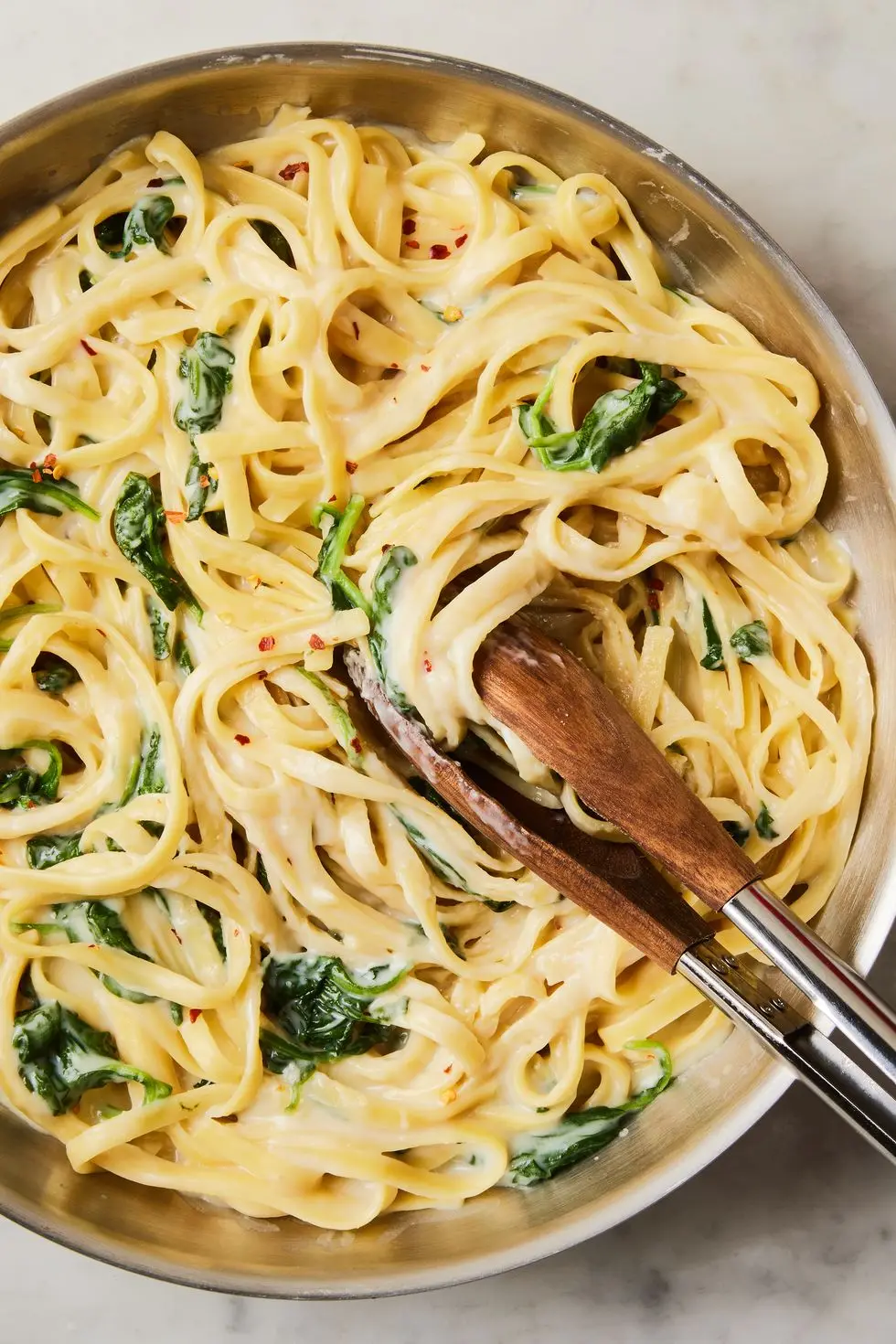 creamy high protein cottage cheese alfredo with spinach and fettuccine