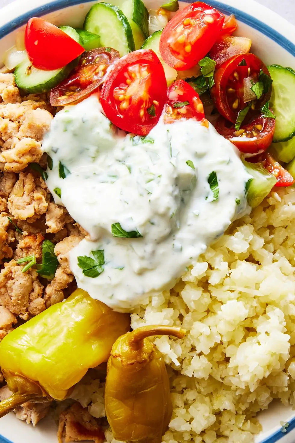 ground turkey with cauliflower rice, cucumber salad, and tzatziki