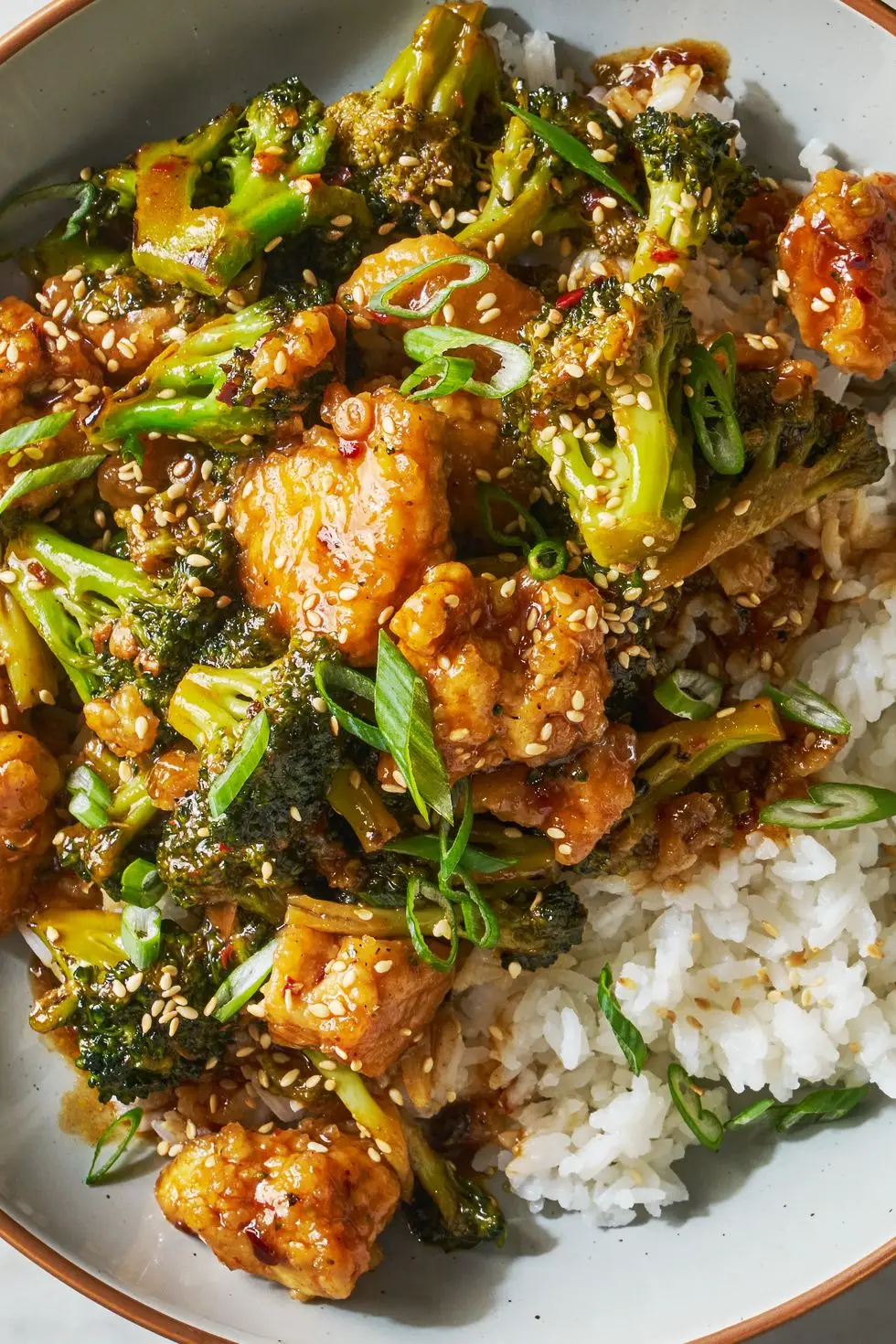 crispy baked tofu tossed with a sweet and savory chili spiked sesame sauce and crisp tender broccoli