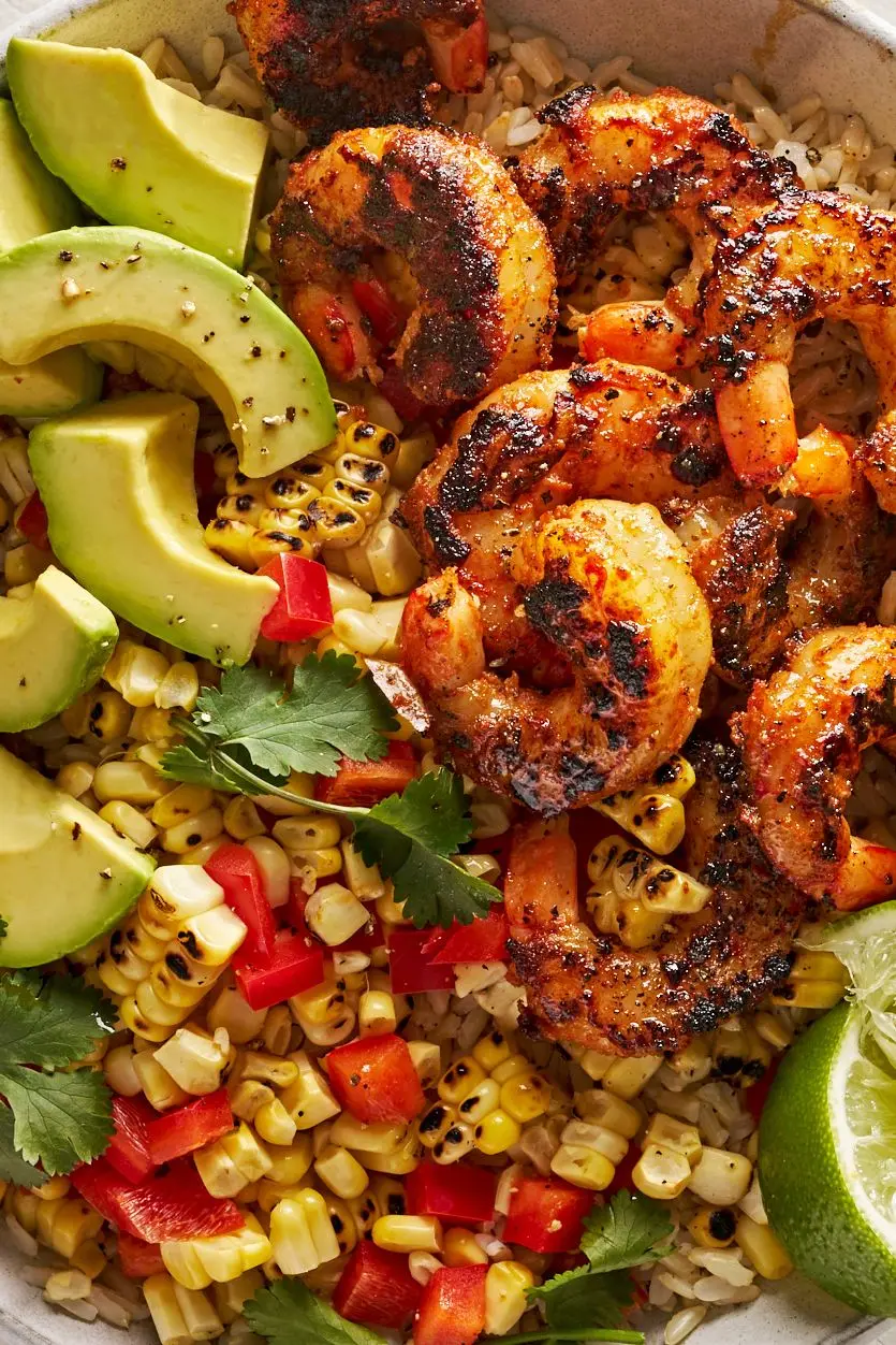 blackened shrimp bowls with grilled corn, avocado, lime, and cilantro