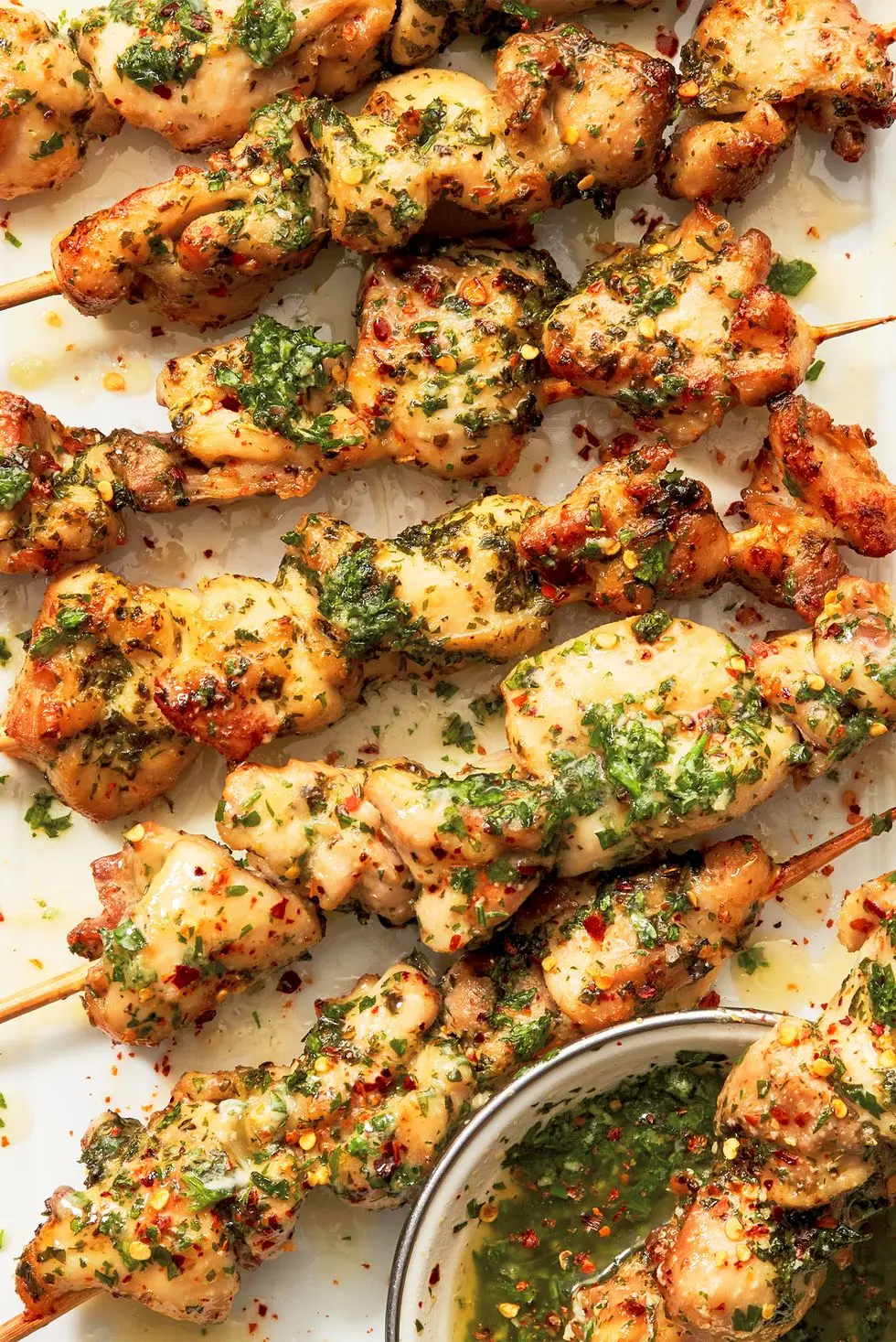 chicken skewers in a garlic herby sauce