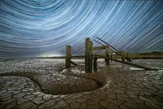 Trailing radial stars over mudflats