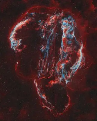 Circular red formation of gas clouds.