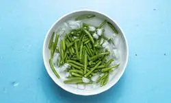 green beans blanching in ice water