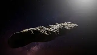 a cigar-shaped rocky object in space