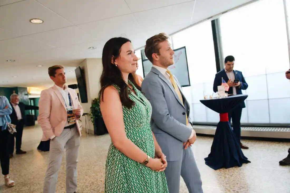 Danielle Butcher Franz and Chris Barnard listen as guests speak at the Conservative Climate Reception held at Mitchell Park Domes in Milwaukee, Wisconsin on the second day of the Republican National Convention. Grace Widyatmadja/NPR