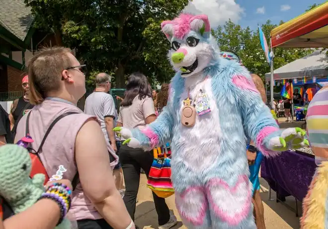 Shahala DeBosco of Peoria, dressed as furry character Elina, attracts some attention during the River City Pride Festival on Saturday, July 20, 2024 on the Peoria riverfront.