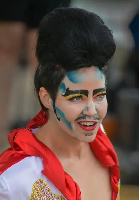 Drag king Max E. Pad sports a giant pompadour hairstyle for an Elvis-inspired show Saturday, July 20, 2024 during the River City Pride Festival on the Peoria riverfront.