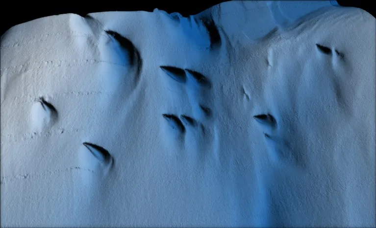 Visualisation of an area on the underside of a glacier shown in various shades of blue