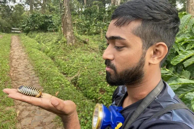 Wildlife biologist Kayden Anthony holding a pill bug on a herpetology expedition in Coorg, Karnataka, in August, 2022. Photo credit: Roma A. Tripathi