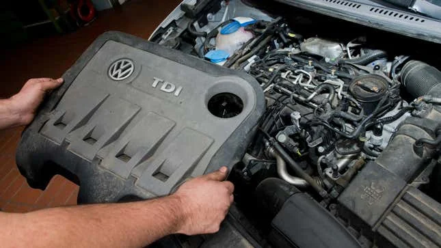 A photo of the engine cover on a VW car. 