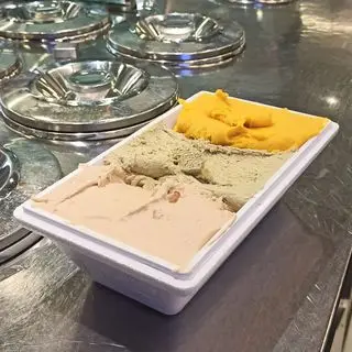 Ice cream in three colour on countertop