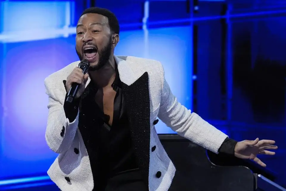 John Legend performs during the Democratic National Convention Wednesday, Aug. 21, 2024, in Chicago. (AP Photo/Paul Sancya)