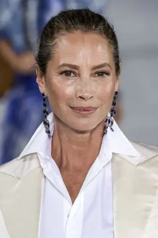 Christy Turlington with glossy skin, one of the key Spring/Summer 2025 Fashion Month beauty looks, on the Ralph Lauren runway