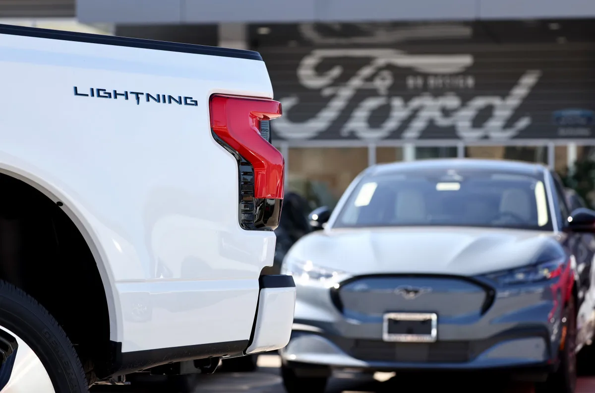 GLENDALE, CALIFORNIA - AUGUST 21: A Ford F-150 Lightning electric pickup truck is displayed for sale at a Ford dealership on August 21, 2024 in Glendale, California. Ford announced it is upending its electric vehicle (EV) strategy for North American vehicles to focus on hybrids, affordability, and longer ranges. (Photo by Mario Tama/Getty Images)