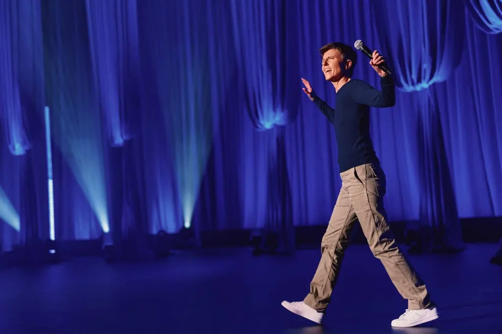 Comedian Tig Notaro holding a microphone