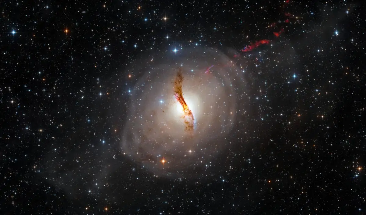 This picture shows the galaxy NGC 5128 and its surrounding tidal wave system