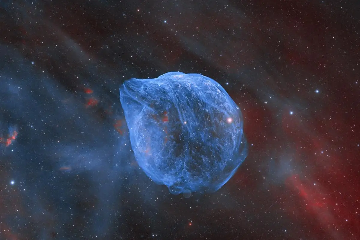 An image of a blue bubble of hydrogen pushed out from a very luminous Wolf-Rayet star